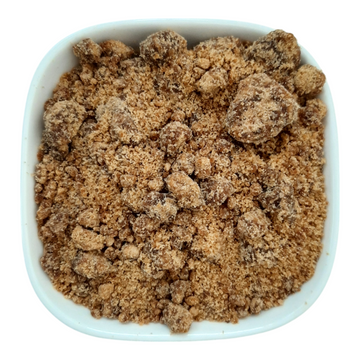 Organic Black Jaggery Powder from Nut Fusion, natural sweetener with dark brown granules and a textured appearance.